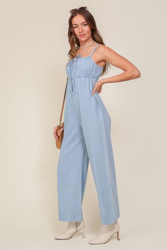 Denim Blue Sleeveless Jumpsuit With Self Jump Tie - ZyraLux