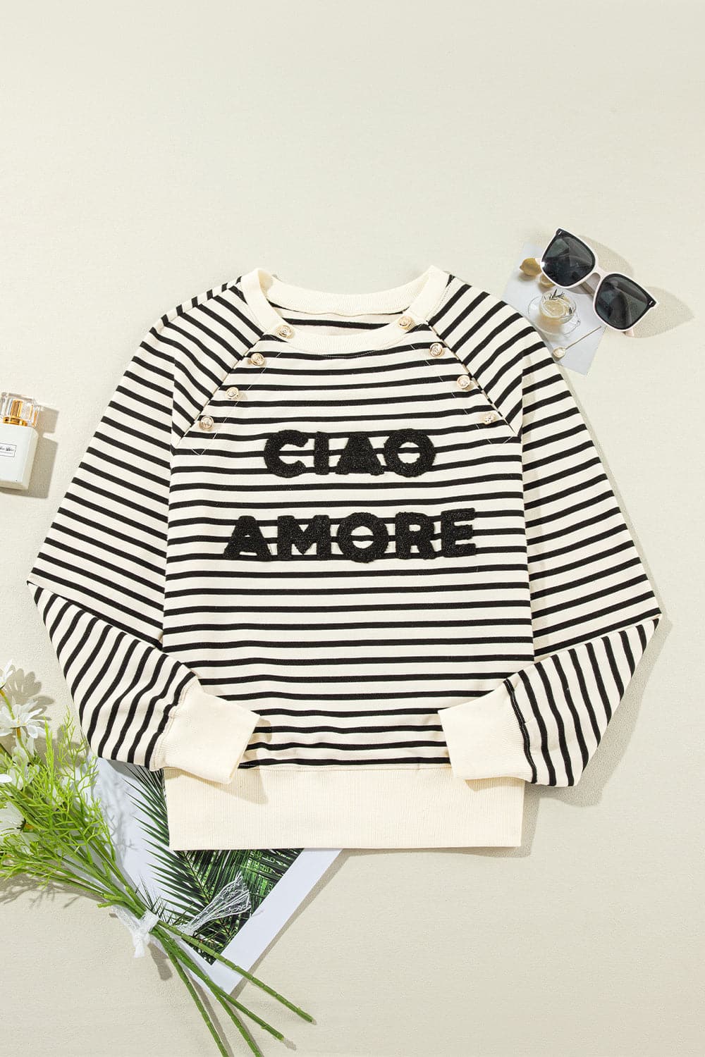 Chique gestreepte sweatshirt met lange mouwen en decoratieve knopen