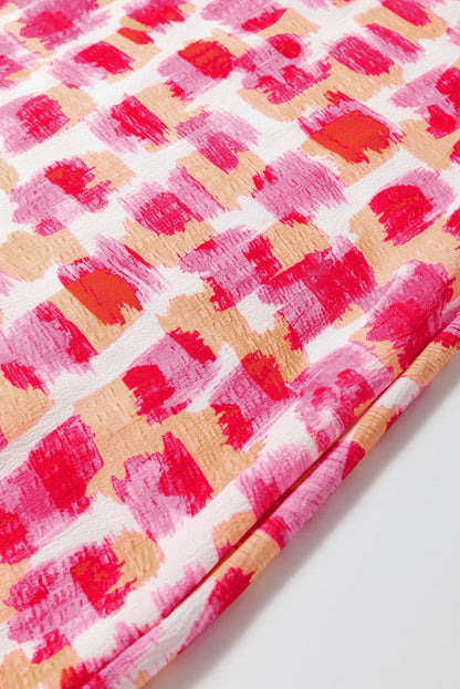 Chique roze abstracte print mouwloze mini-jurk met flirterige volanthalslijn