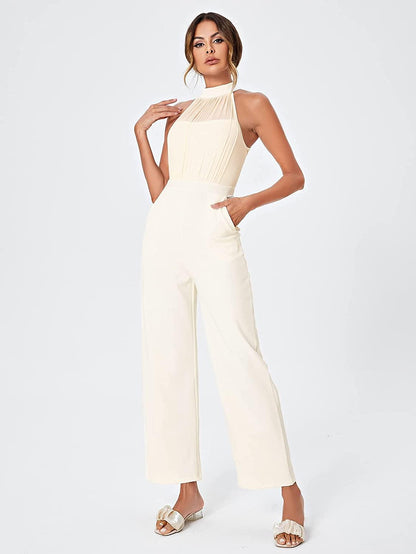 Prachtige halter mouwloze crème beige wijde pijp jumpsuit